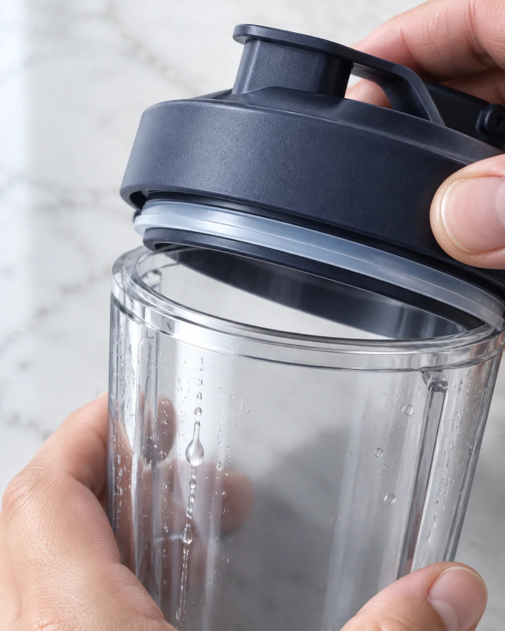 A tight macro photograph of the travel-cup lid and the small clear sealing ring from the exact blend